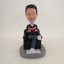 Picture of Custom Bobblehead Doll: Man Reading in Sofa